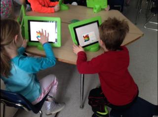 Davis students using iPads to complete classroom assignments.
