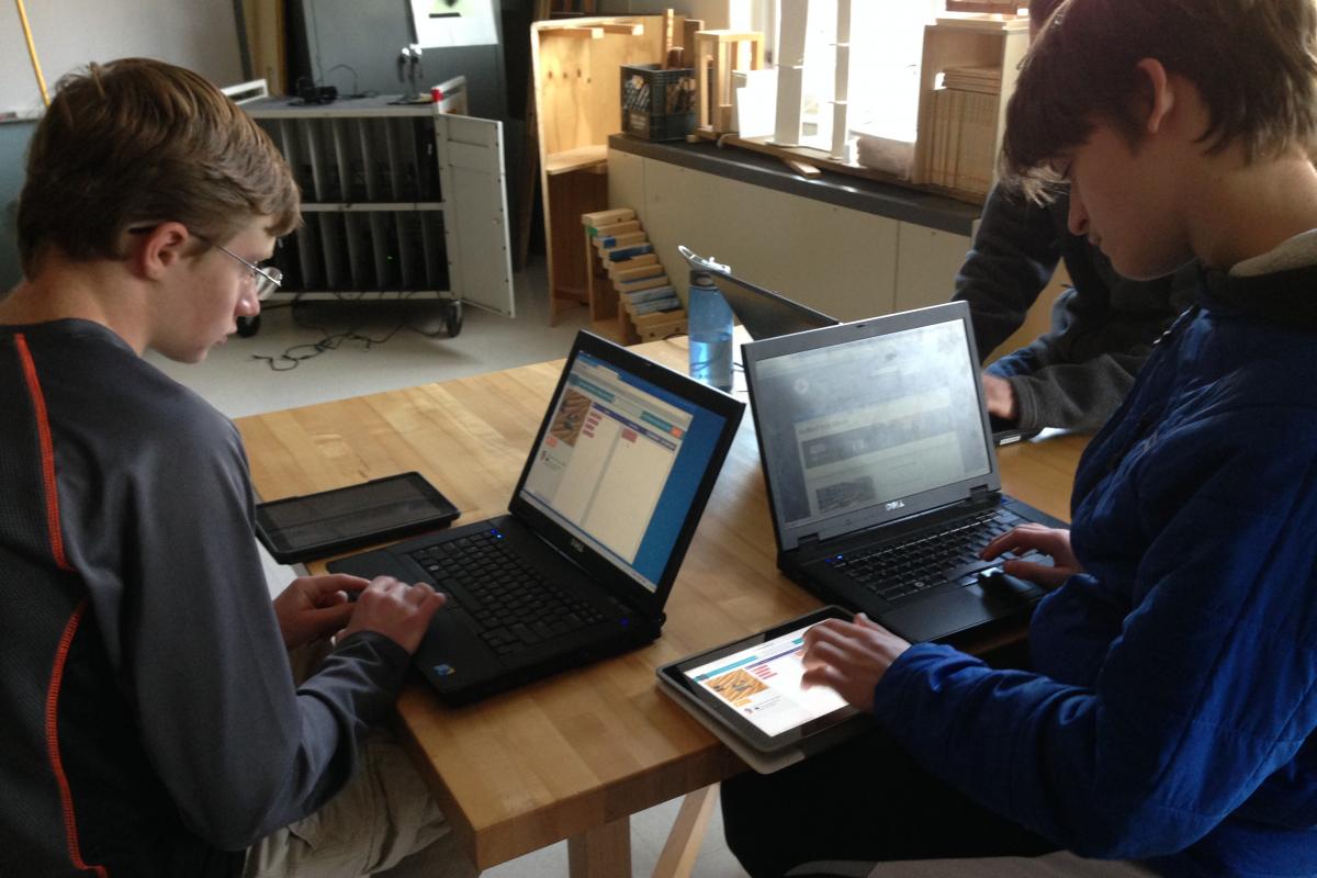 High School students creating code.