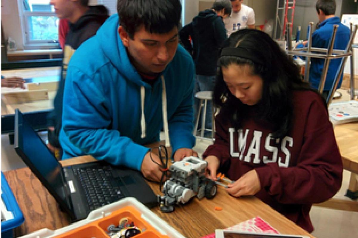 High School students programming robots.