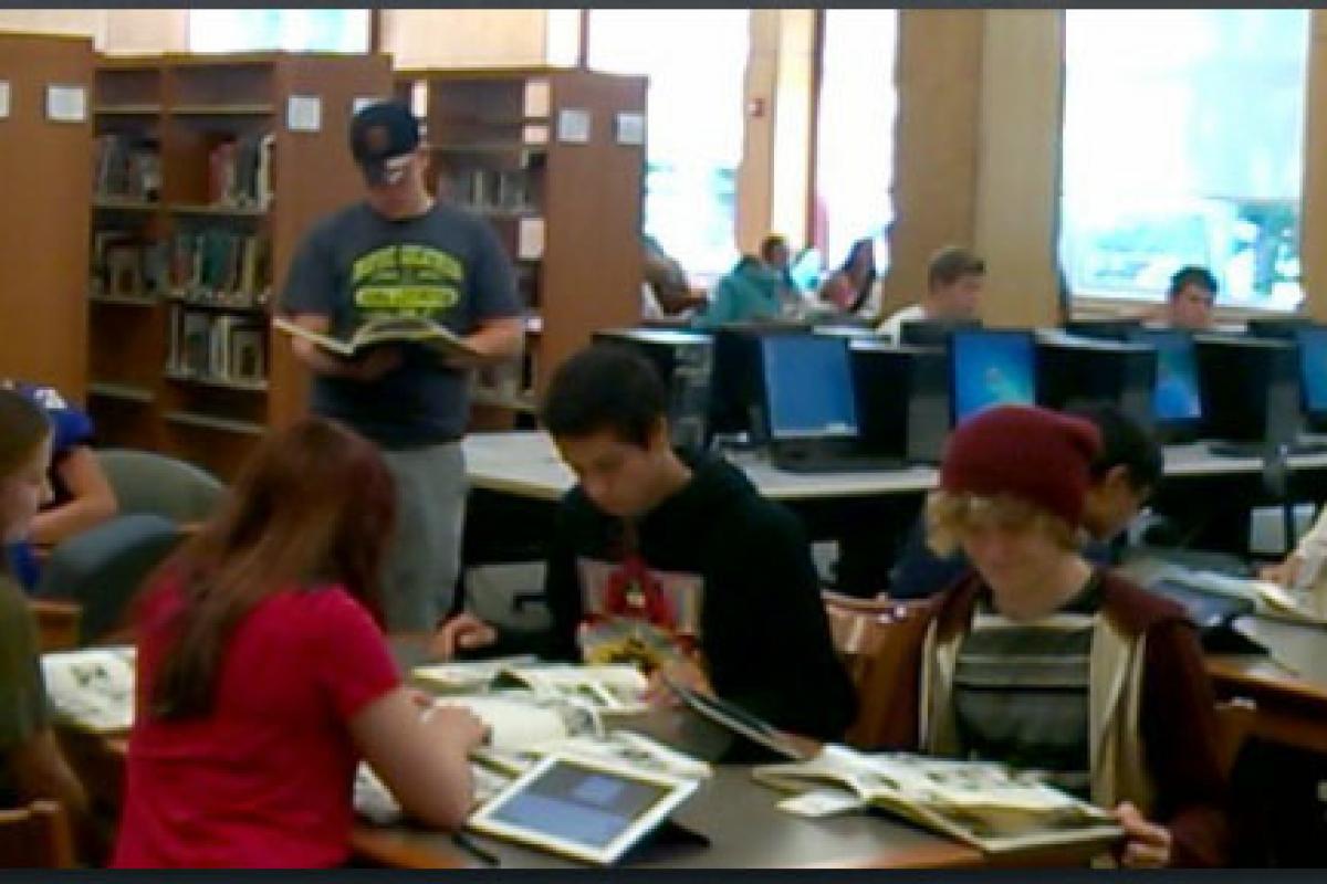 High School students working in the library.