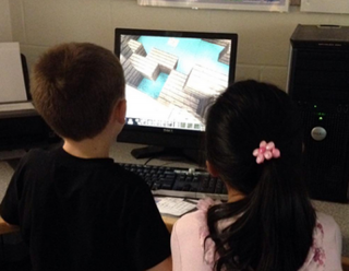 Davis students creating structures in Minecraft.