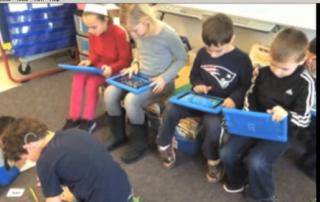 Davis students using iPads to solve math problems.