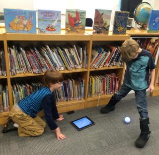 Davis students programming Sphero robots.
