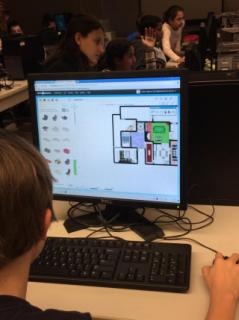 JGMS students using software to design the layout and interior of a house.