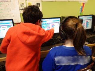 Lane students working collaboratively on a coding activity during the Hour of Code.